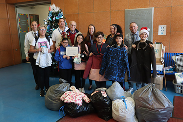 Coats collected for the Wisdom Lane Middle School Builder's Club Coats for Kids Drive were donated on Dec. 19.