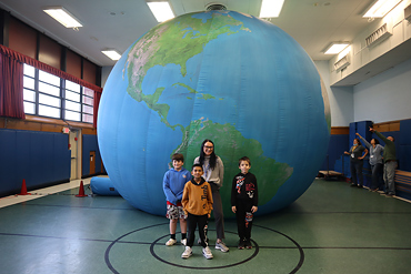 Everyone was ecstatic to see the giant globe inflated in the school gymnasium.
