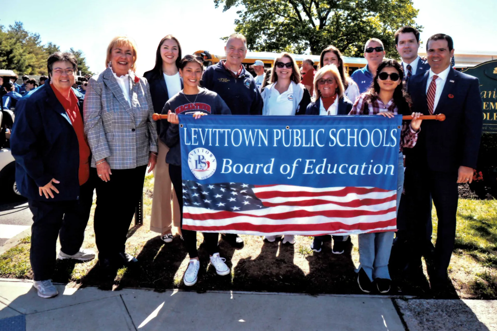 Board of Education Members pose for a photo during the Memorial Day Parade