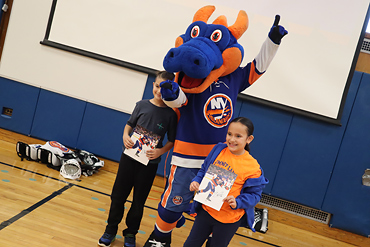 The New York Islanders mascot Sparky visited Summit Lane school on Dec. 12 and offered free tickets through a raffle.