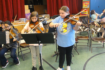 In March, selected 4th and 5th-grade students took part in an assembly to recruit 2nd-grade students for instrumental lessons.