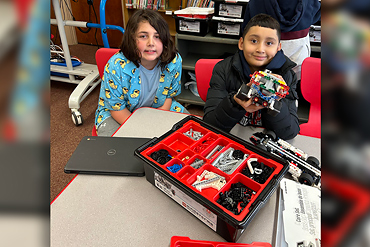 In LEGO Robotics Club at Gardiners Avenue, guided by Ms. Kissane, students explored engineering by building and programming versatile car-like robots using LEGO Mindstorms software.