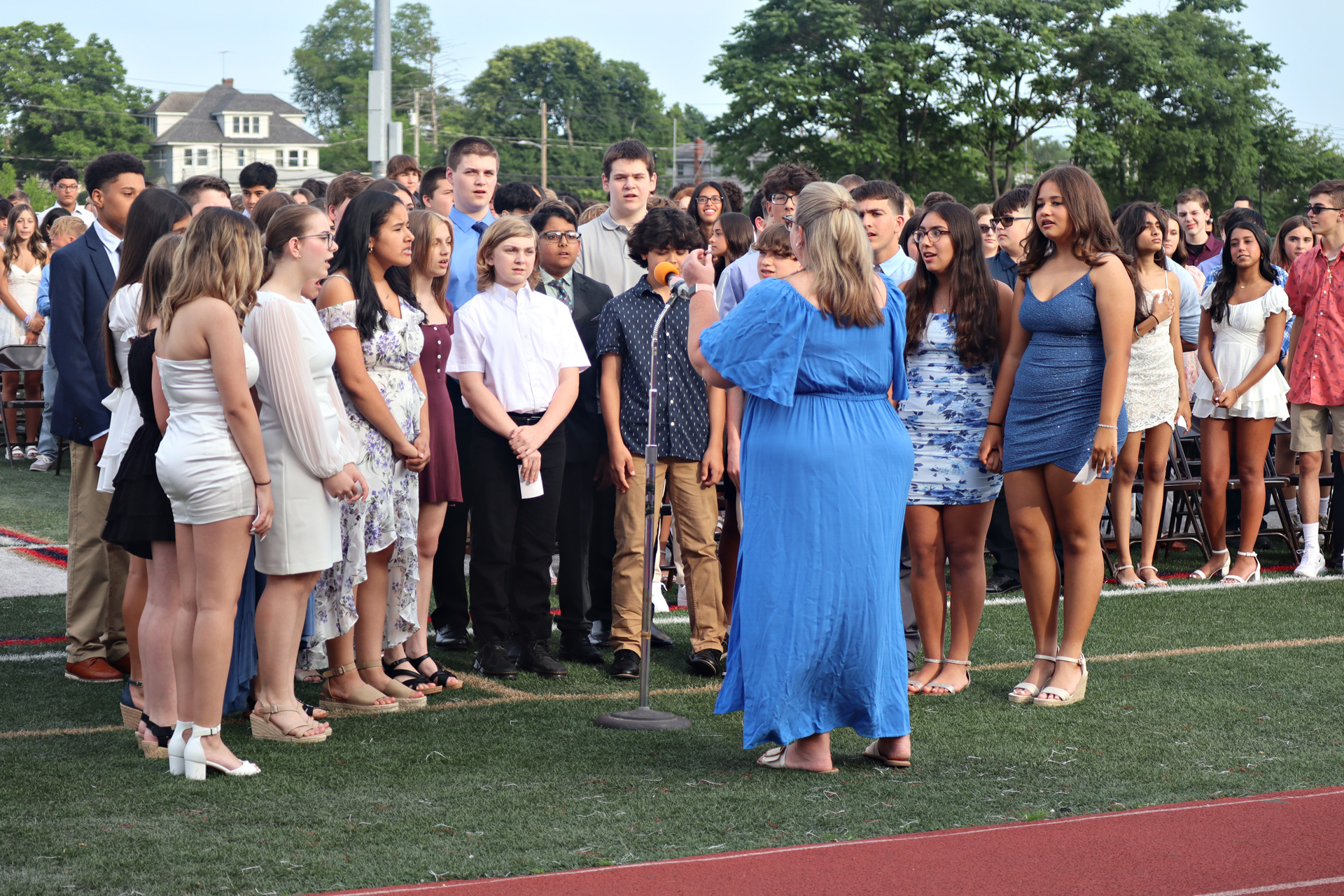 Members of the eighth grade chorus sang the national anthem.