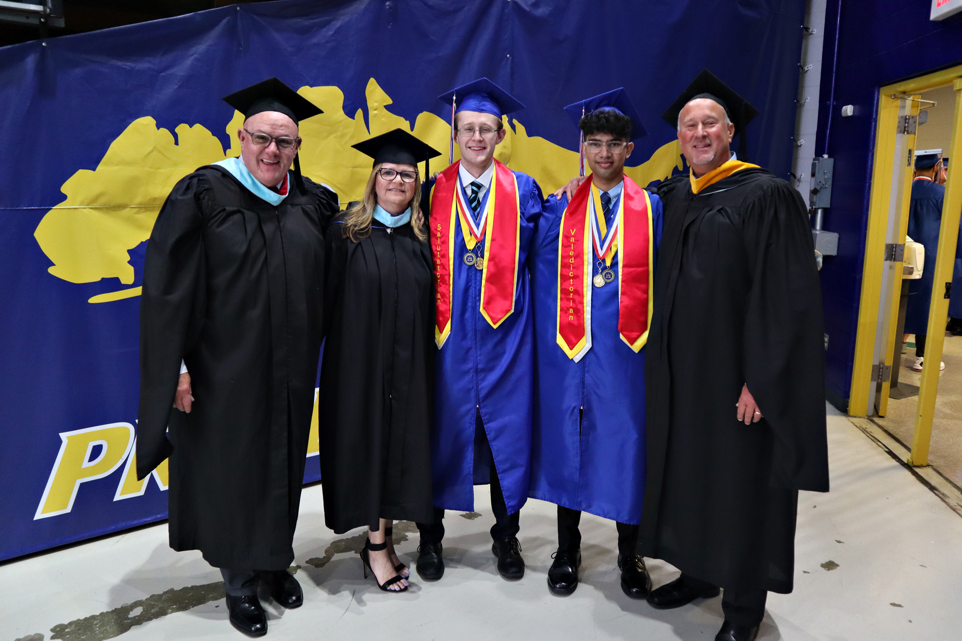 General Douglas MacArthur High School salutatorian Benjamin Campbell and valedictorian Zarif Jamal stood with Assistant Principals Terence Ryan and Anne Rao and Principal Joseph Sheehan before the commencement ceremony on June 22.