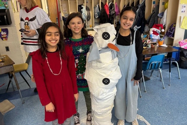 Students in Mr. Centonze's class participated in a team-building snowman wrapping project, where they collaborated to create their very own snowman.