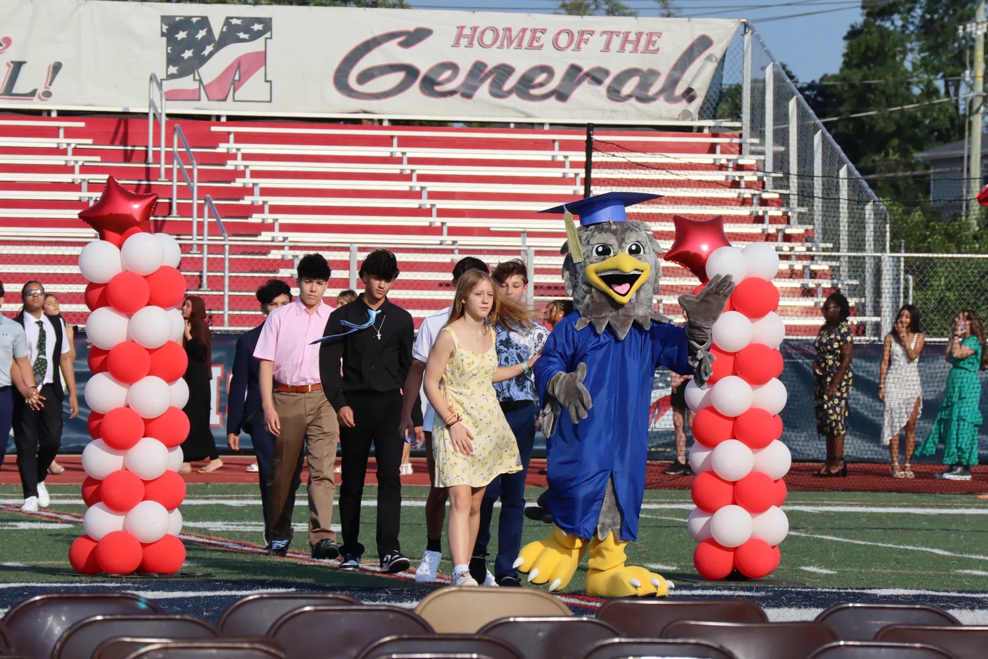 Jonas E. Salk Middle School's eighth grade graduate processed onto the General Douglas MacArthur High School field during their moving up ceremony on June 11.