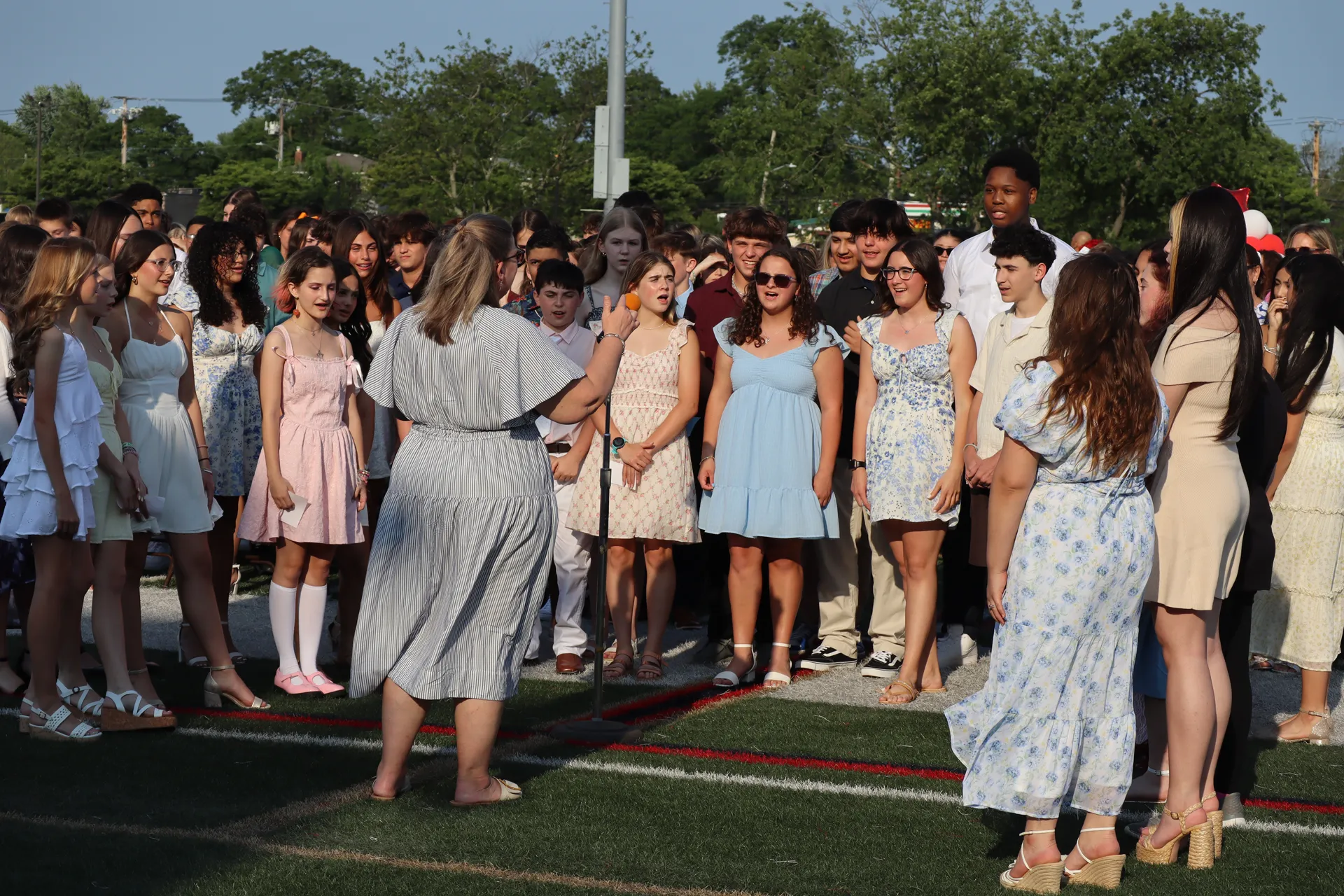 The eighth grade chorus opened the ceremony with the national anthem.