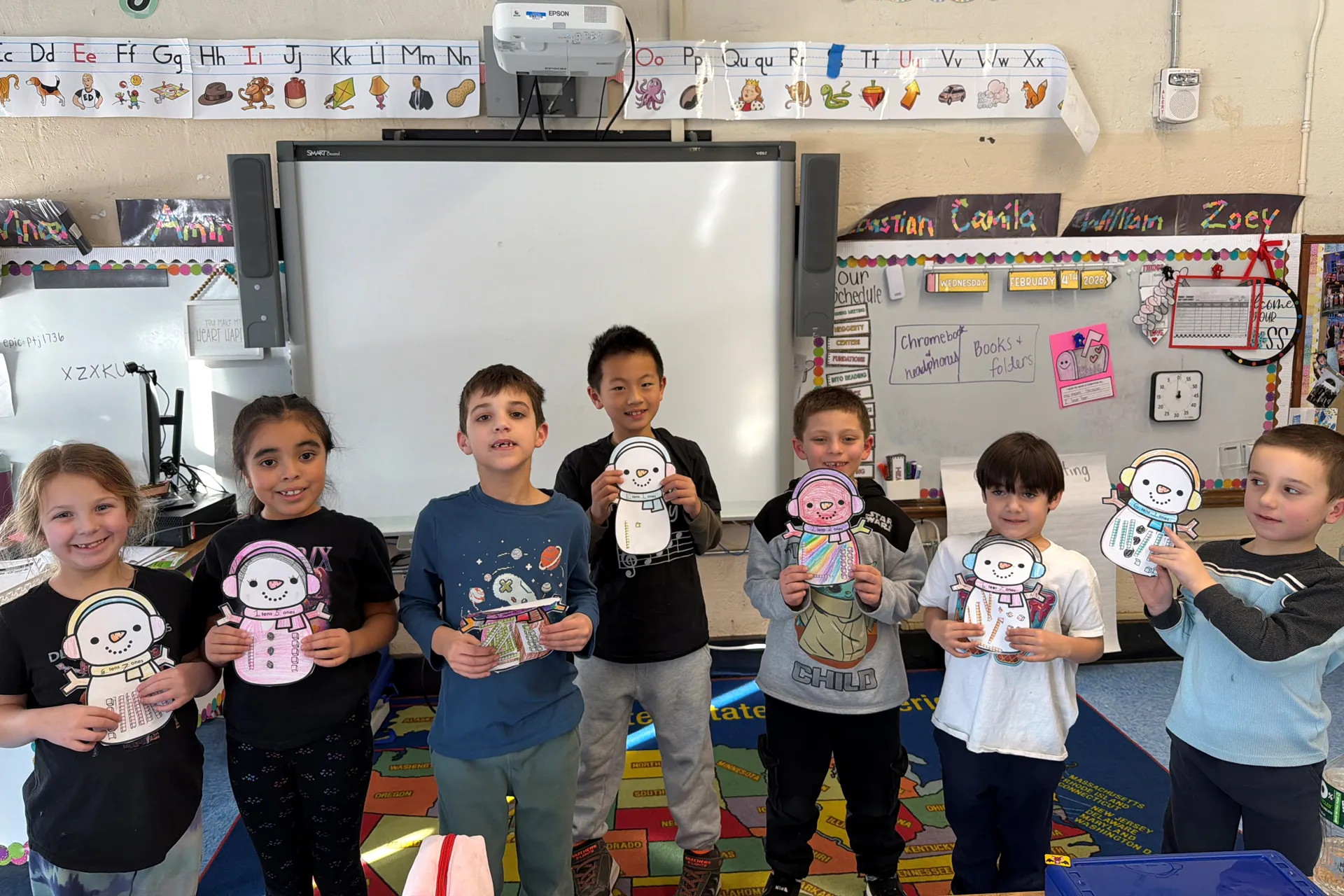 After learning about place value, Ms. Coppola's class chose their own numbers and made snowmen with tens and ones blocks to represent their numbers.