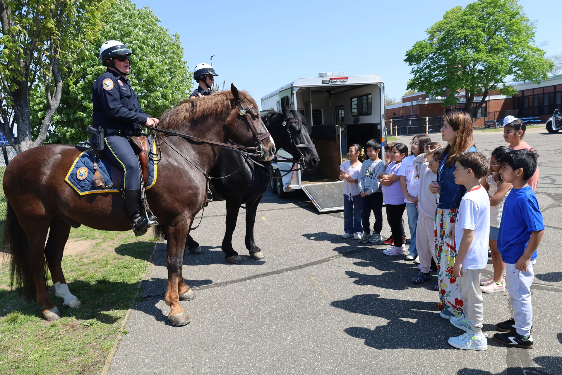 Students were impressed by mounted police horses and asked officers thoughtful questions.
