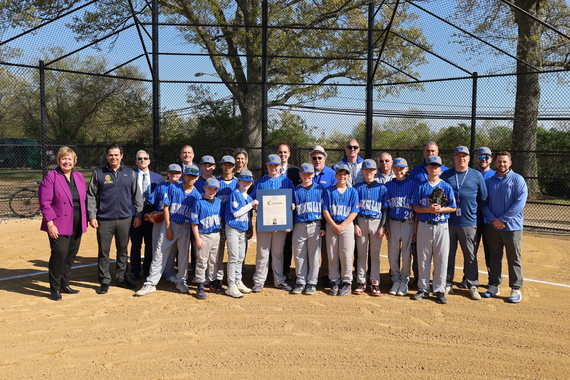 Town officials presented a citation to mark the opening of the school's baseball field.