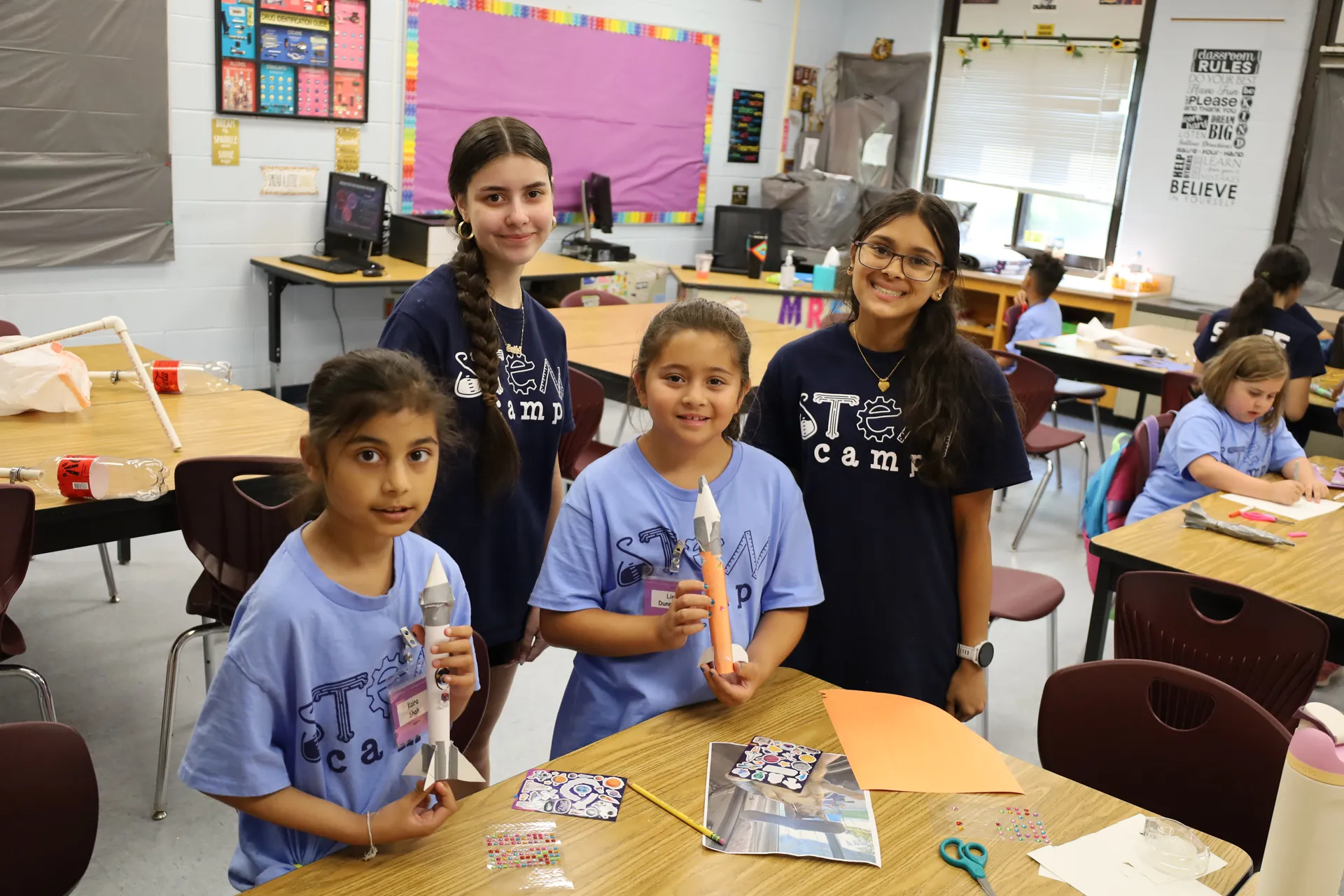 Third graders Kaira Shah and Lina Dunninger created rockets with help from their 11th grade peers, Emily Sudberg and Sahrina Choudhury.